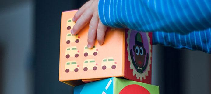 Child playing with building blocks